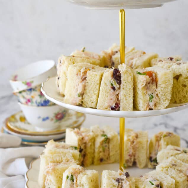 chicken salad tea sandwiches on a tiered plate