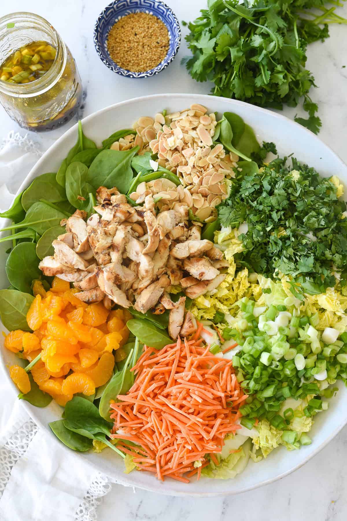 overhead shot of all the salad ingredients in a bowl