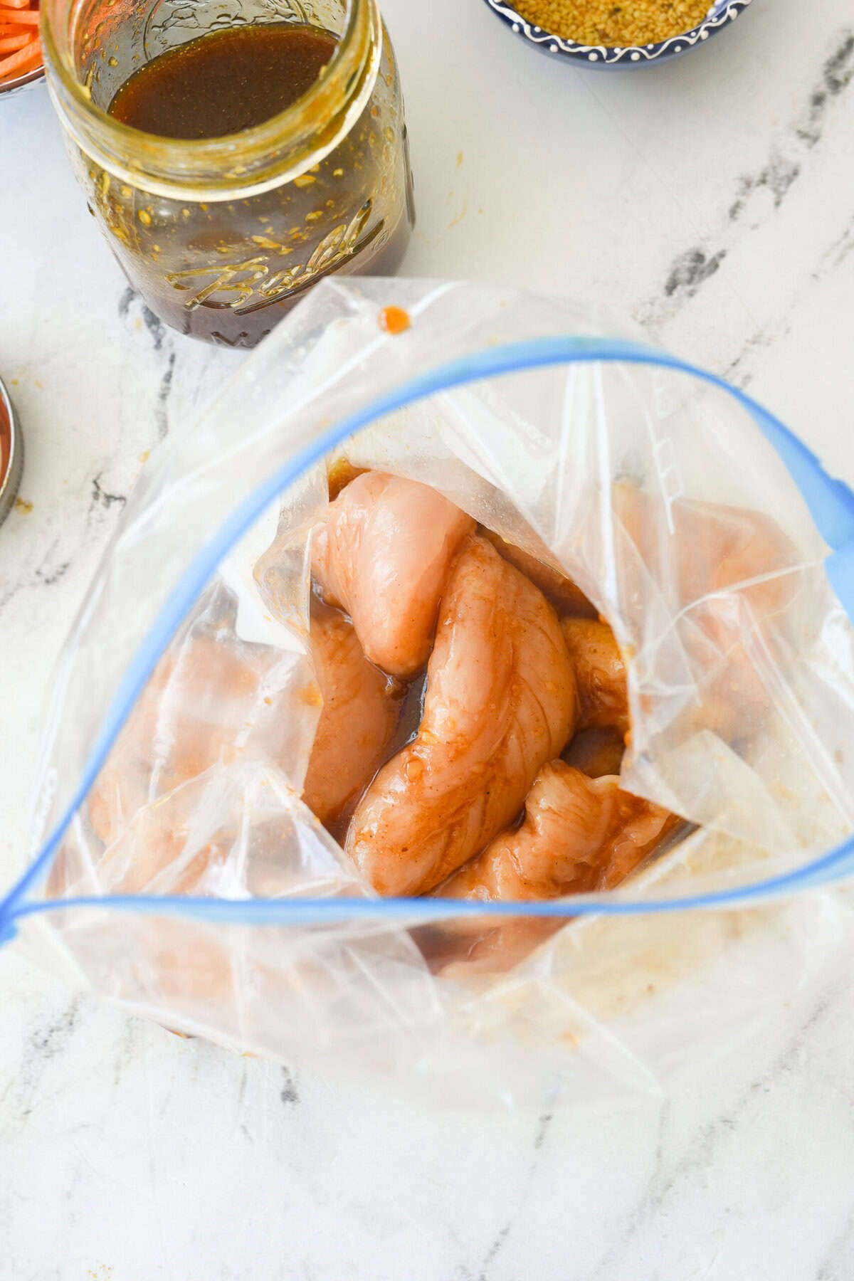 chicken marinating in a bag.