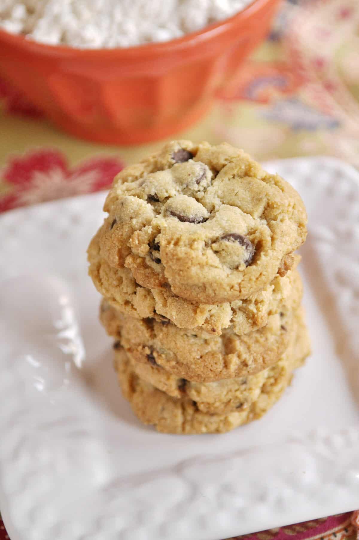 stack of gluten free chocolate chip cookies on a plate.