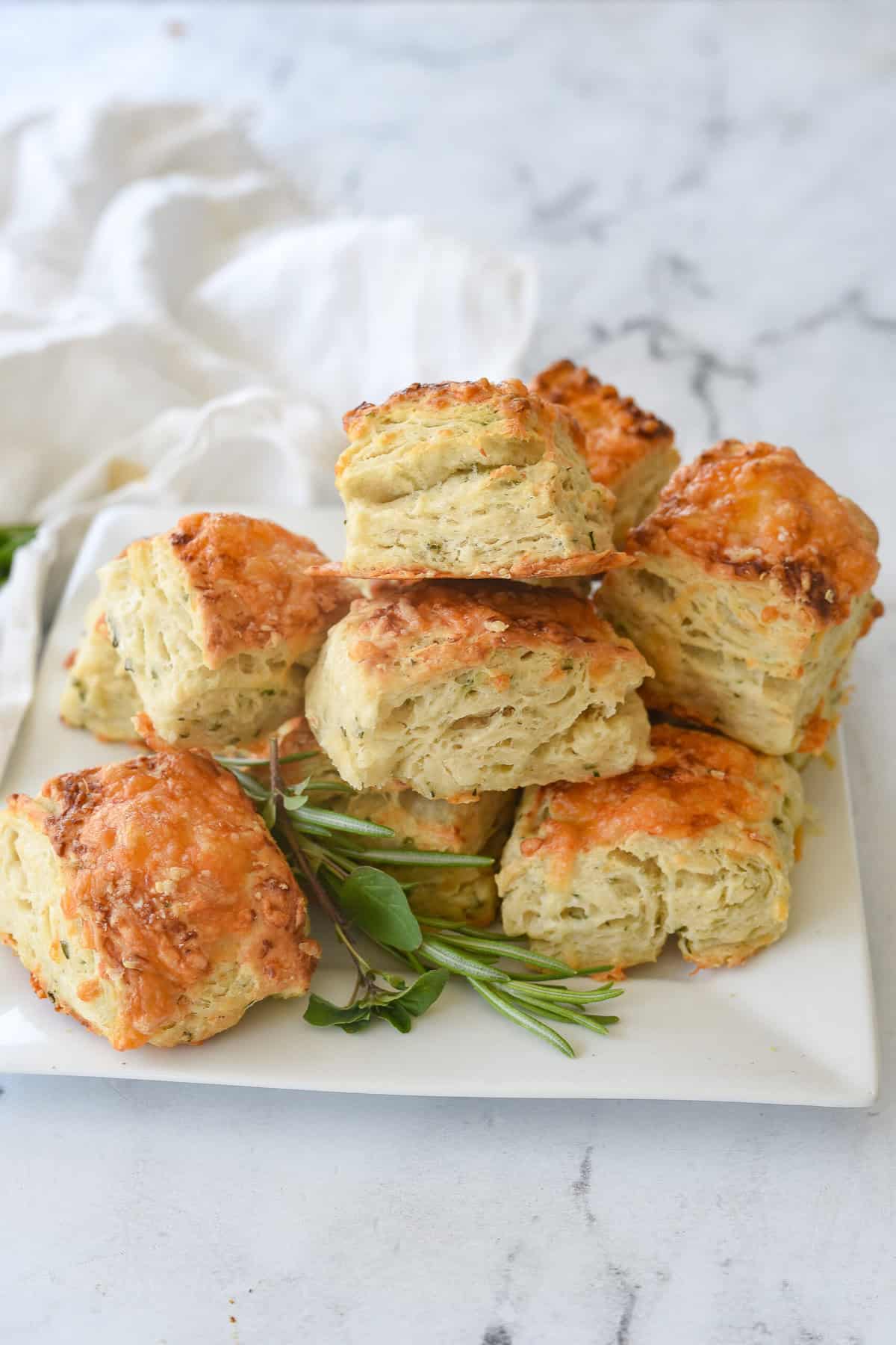 plate of savory cheese scones on a white plate