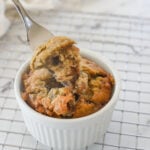 fork full of banana bread for one in a white ramekin