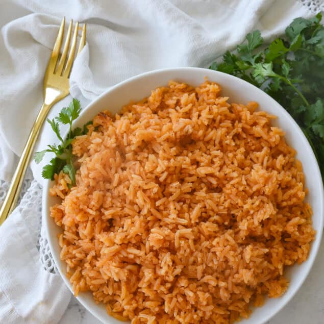 overhead sho t of white bowl full of mexican rice