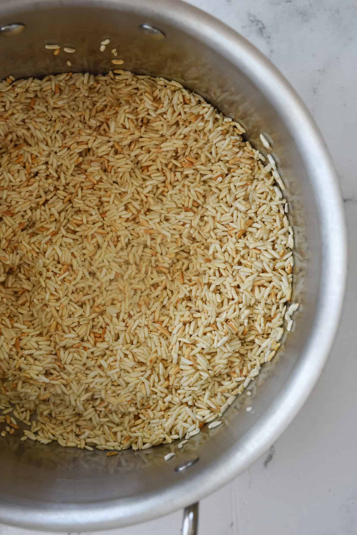 browned rice in sauce pan