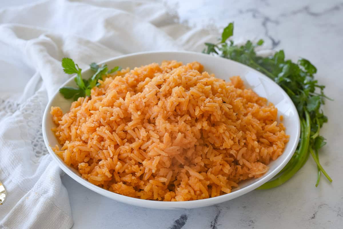 bowl of mexican rice with cilantro on top