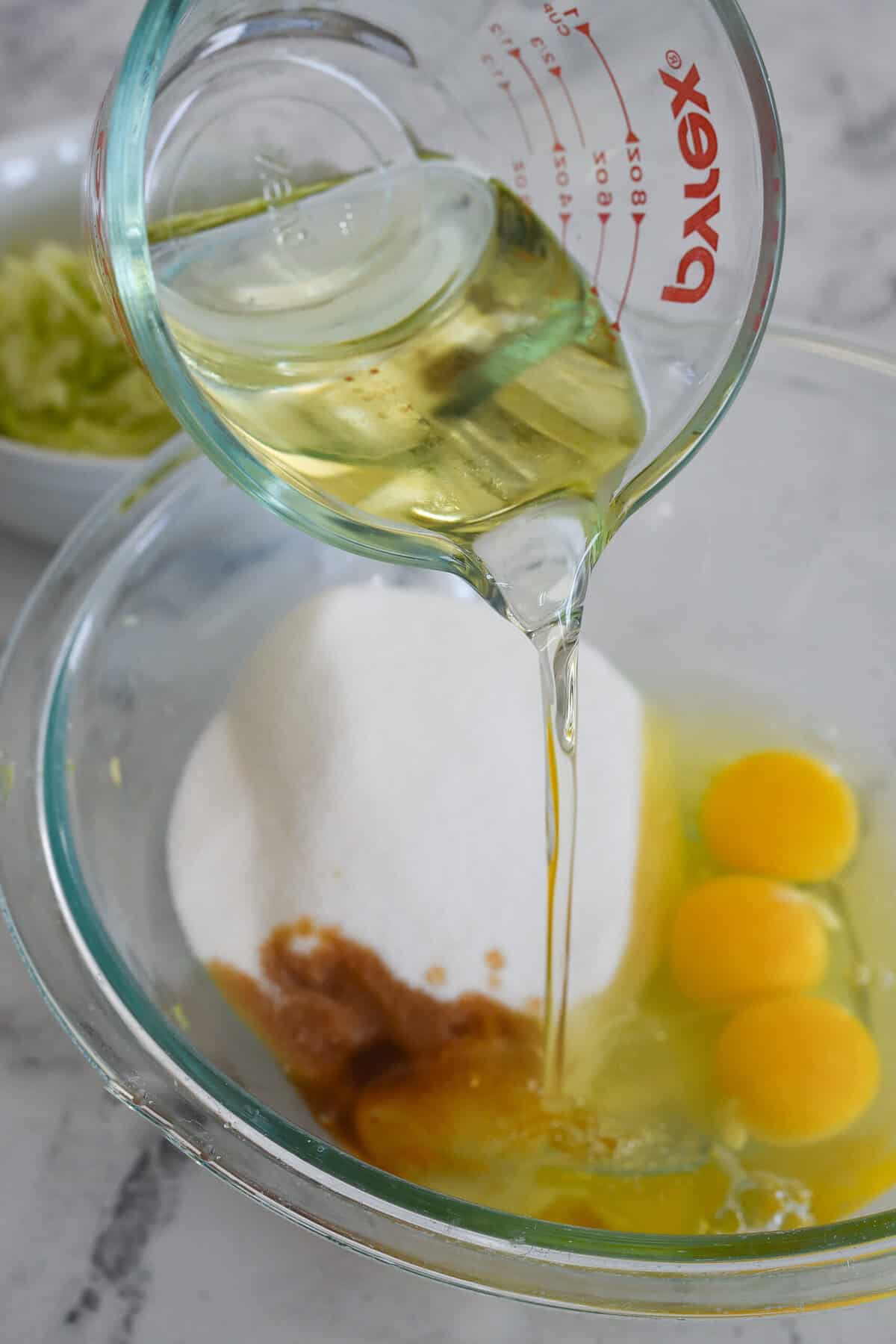mixing liquid ingredients together for chocolate zucchini bread