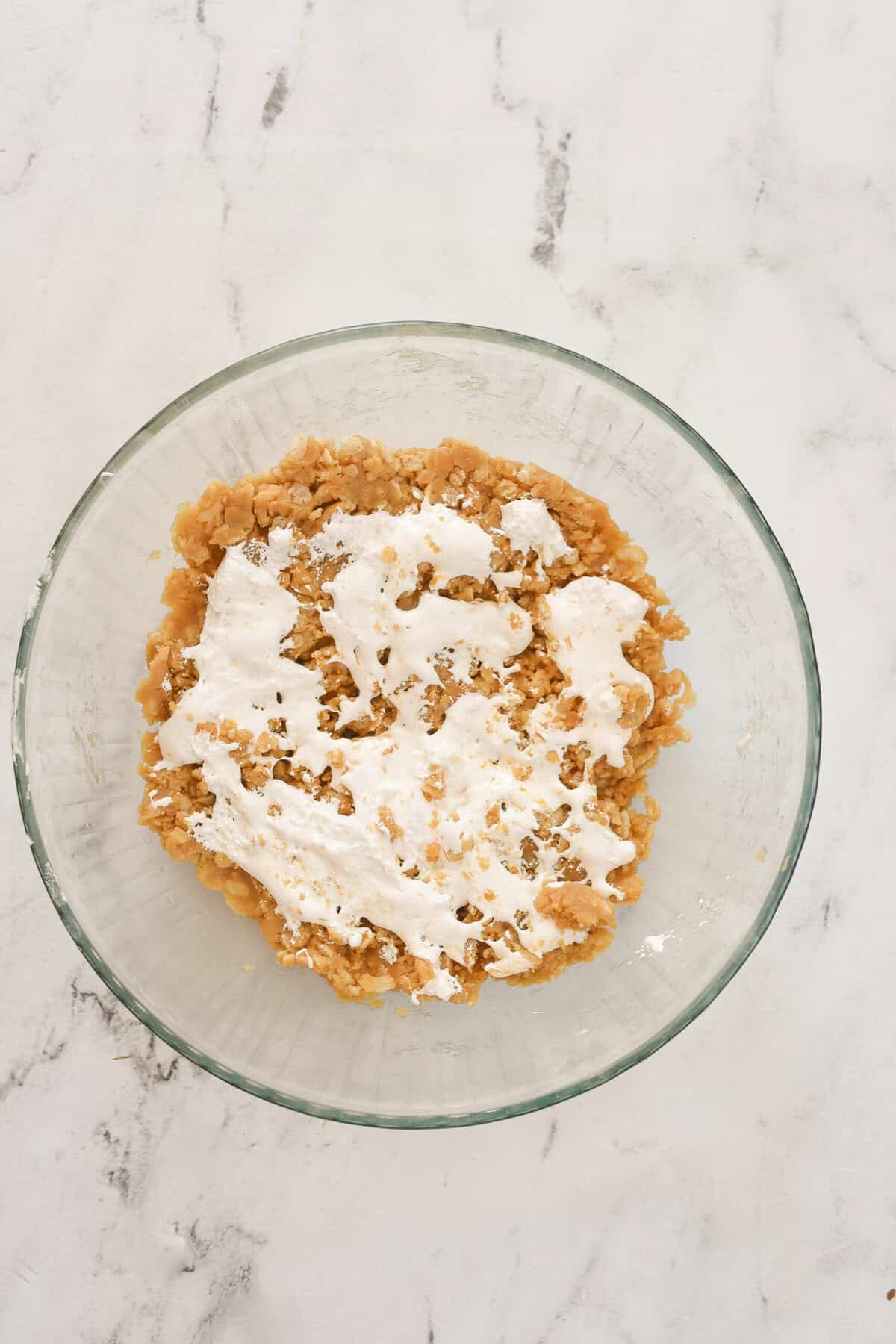 marshmallow fluff spread over top of rice krispie cookie dough