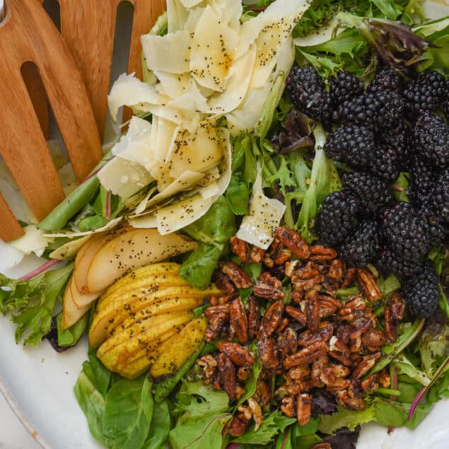 overhead shot of a blackberry ad pear salad