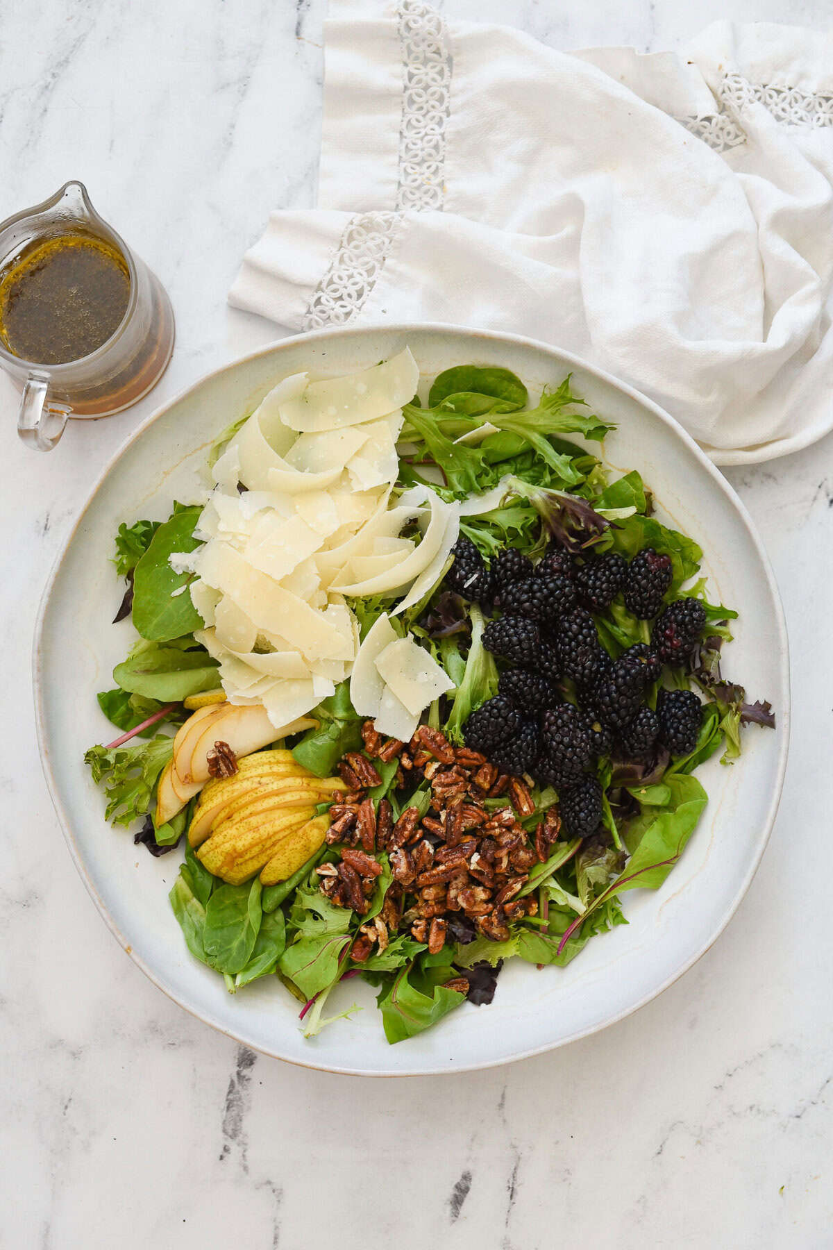 blackberry and pear salad ingredients in a bowl.