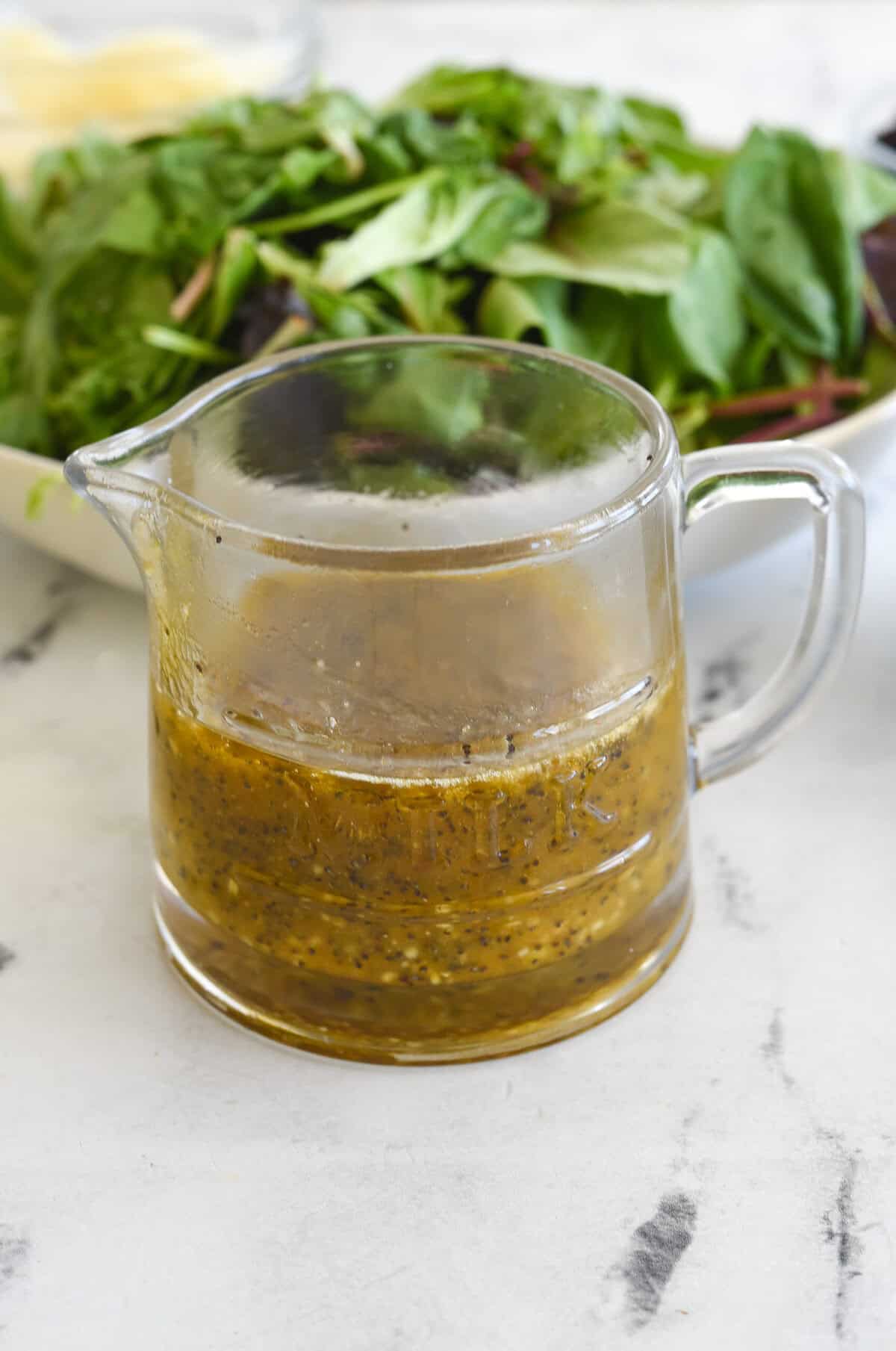 poppy seed dressing in a clear pticher