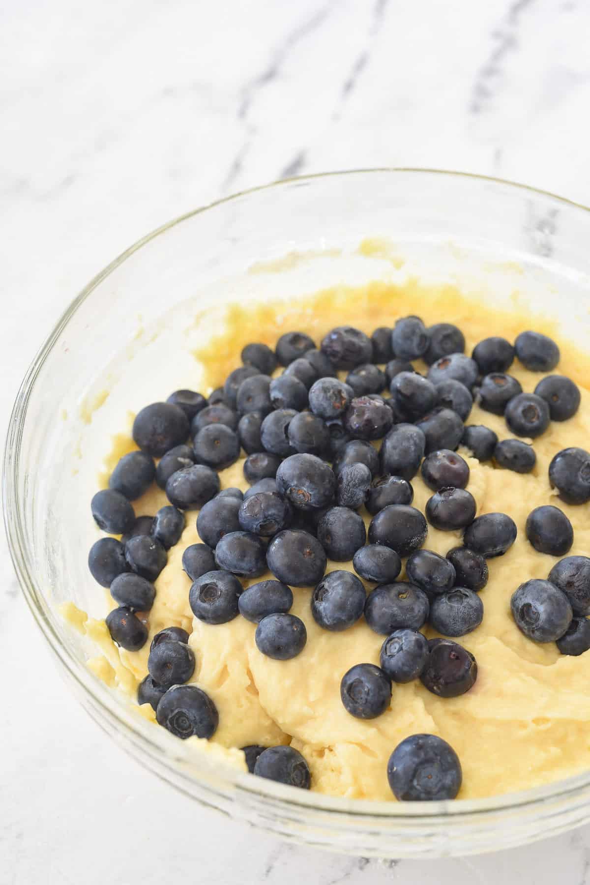 adding blueberries into freeze muffin batter
