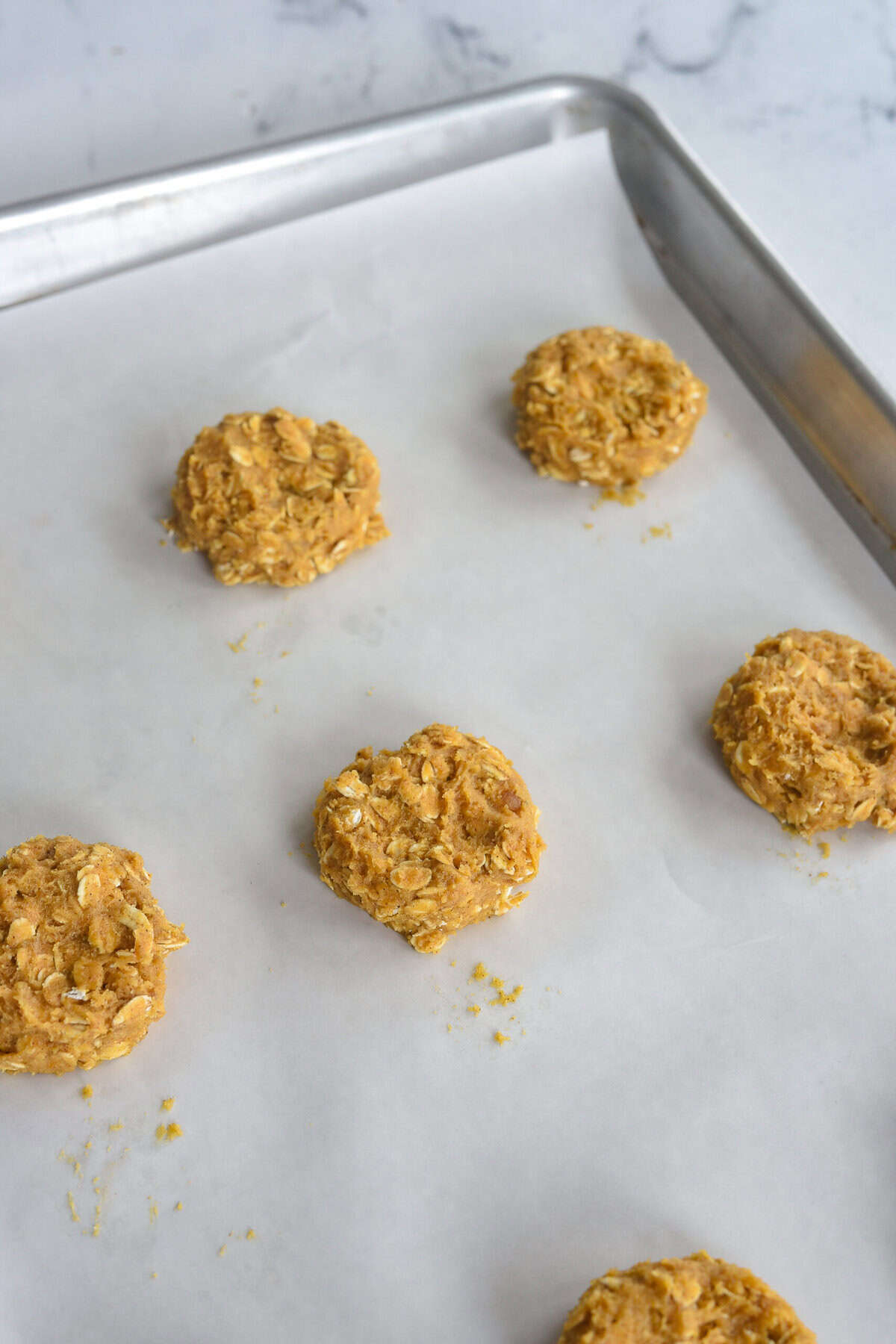 flatten cookie dough on a bakng sheet.