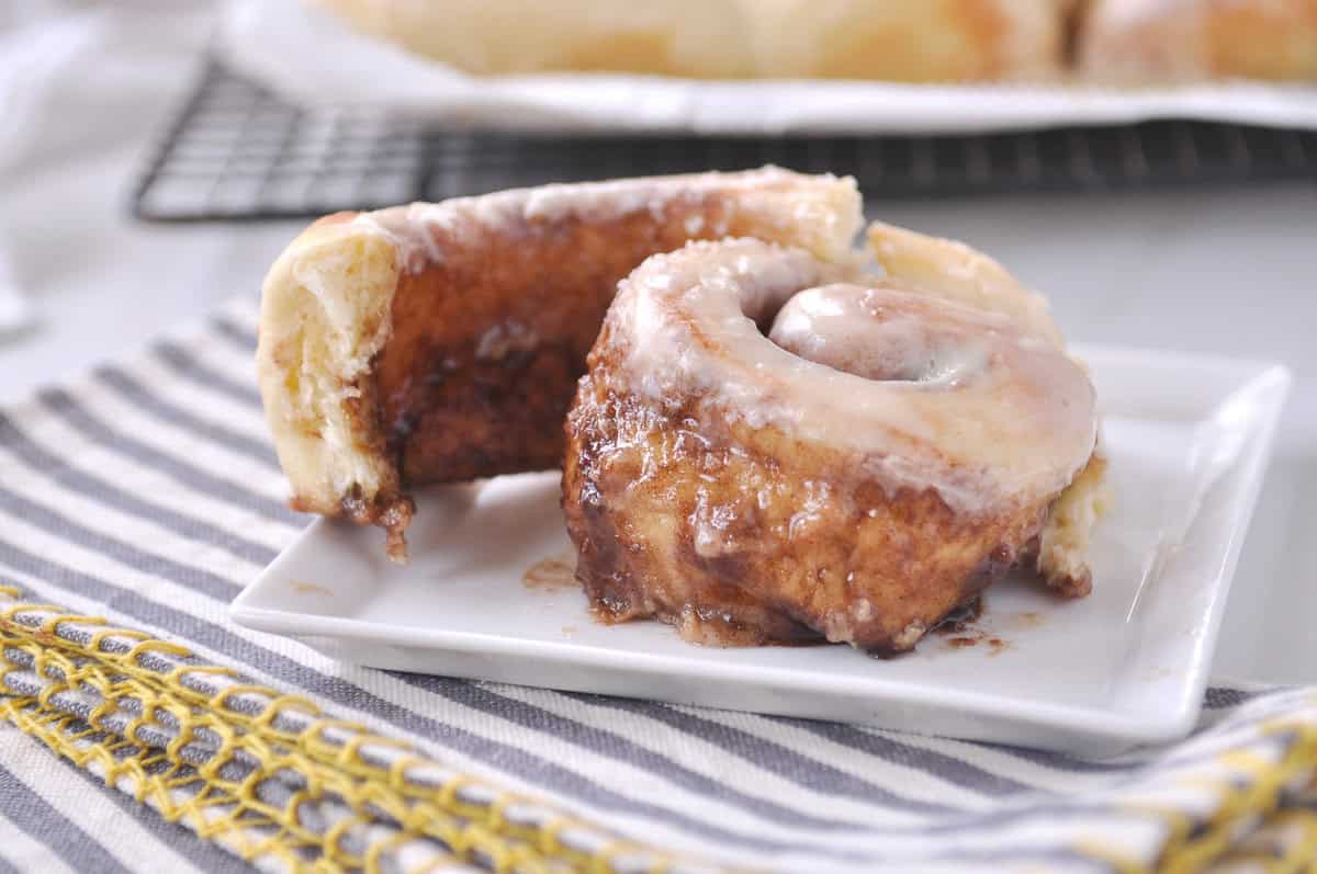 baked cinnamon roll on a white plate
