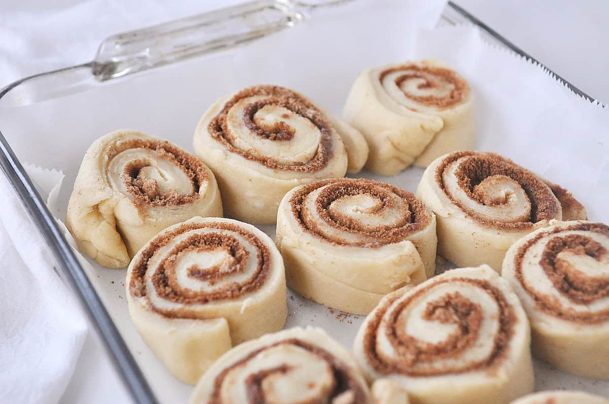 cut cinnamon rolls in pan ready to rise