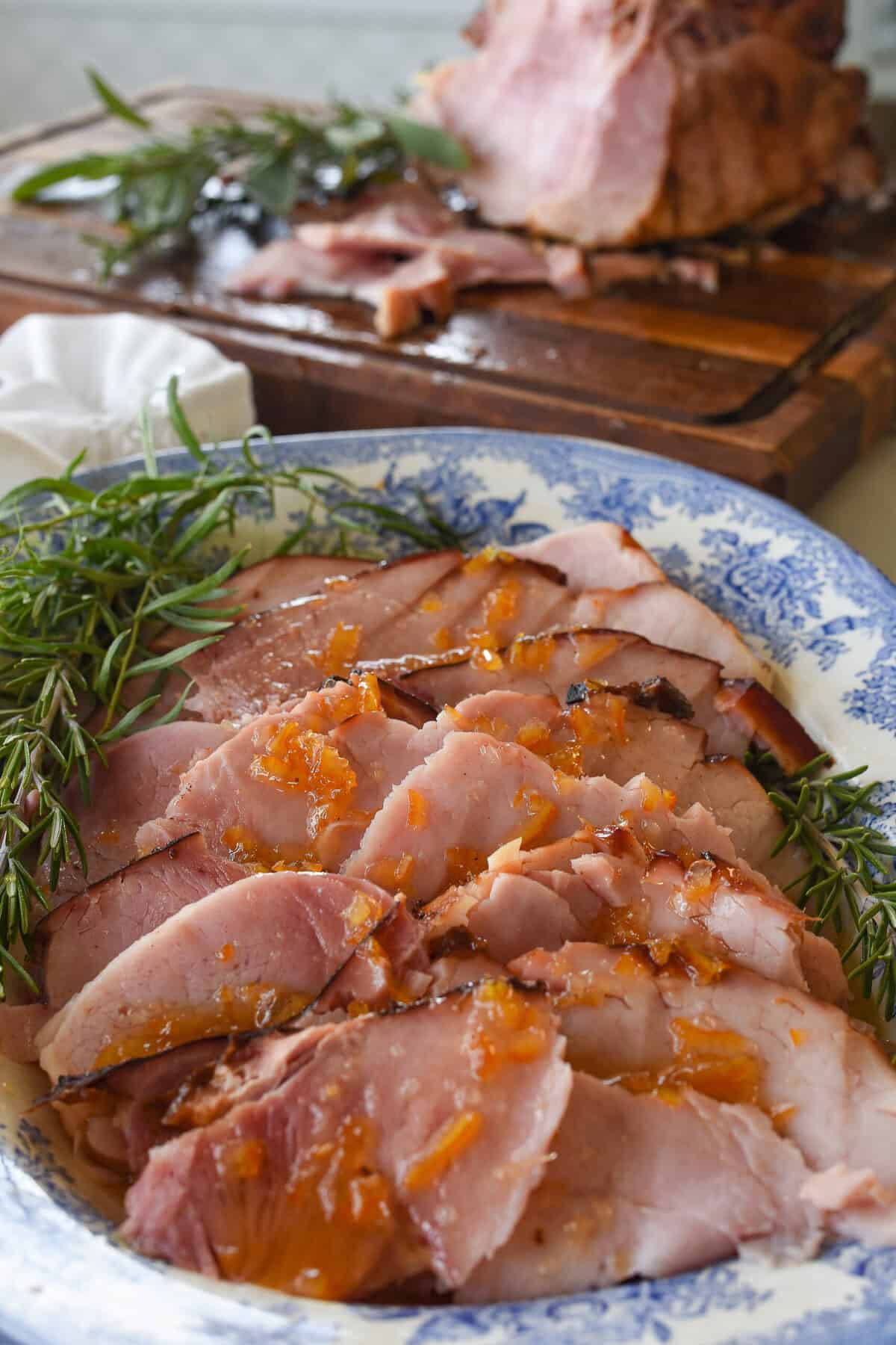 grilled ham sliced on serving plate.