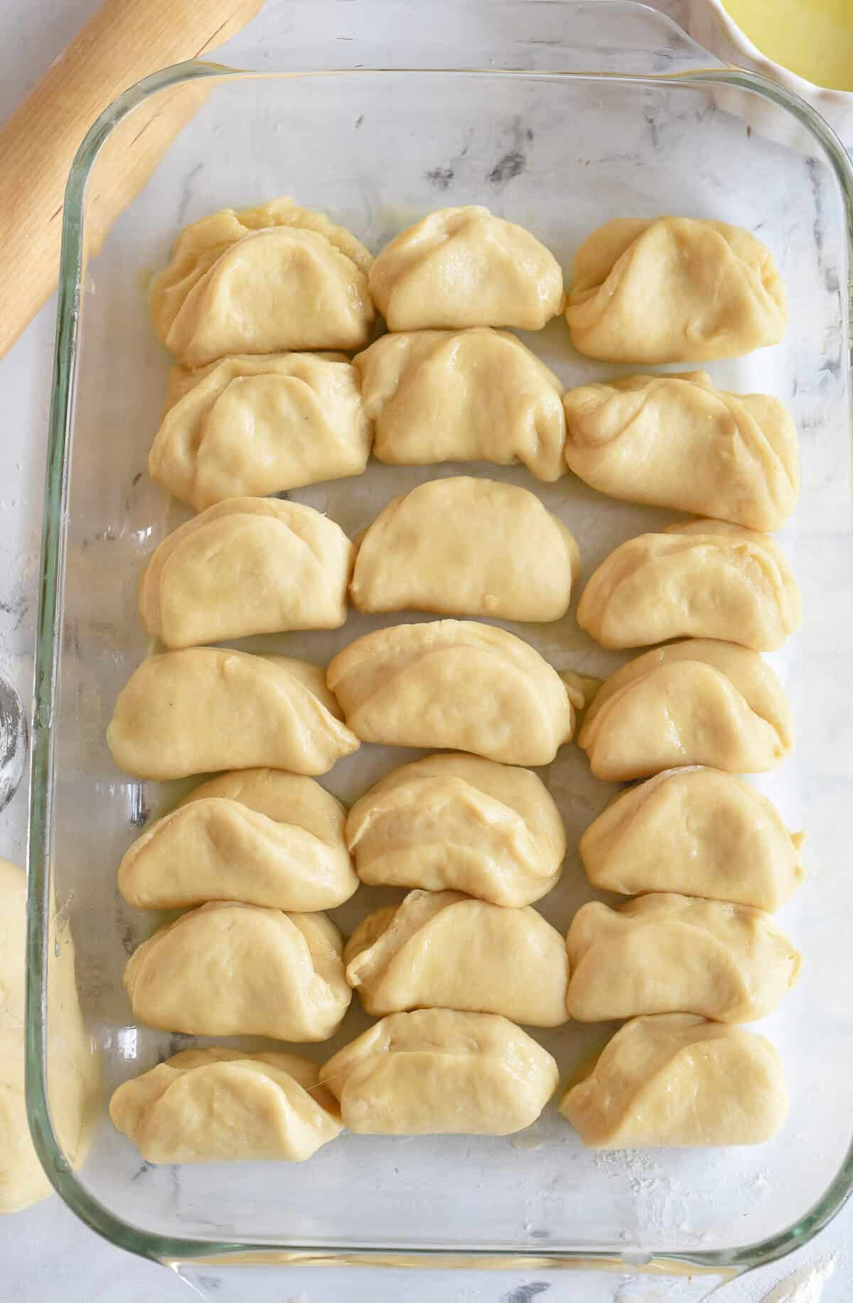 parker house rolls in pan ready to rise