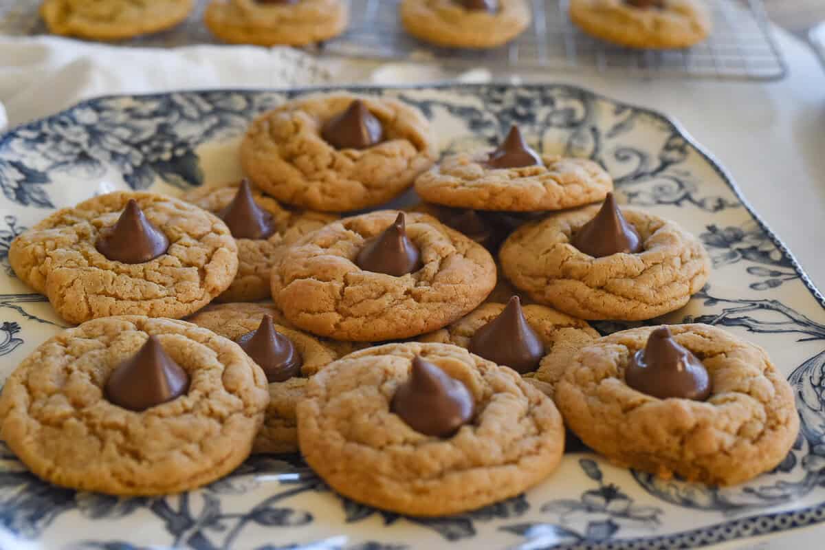 peanut butter blossom cookies on a blue and white pklate