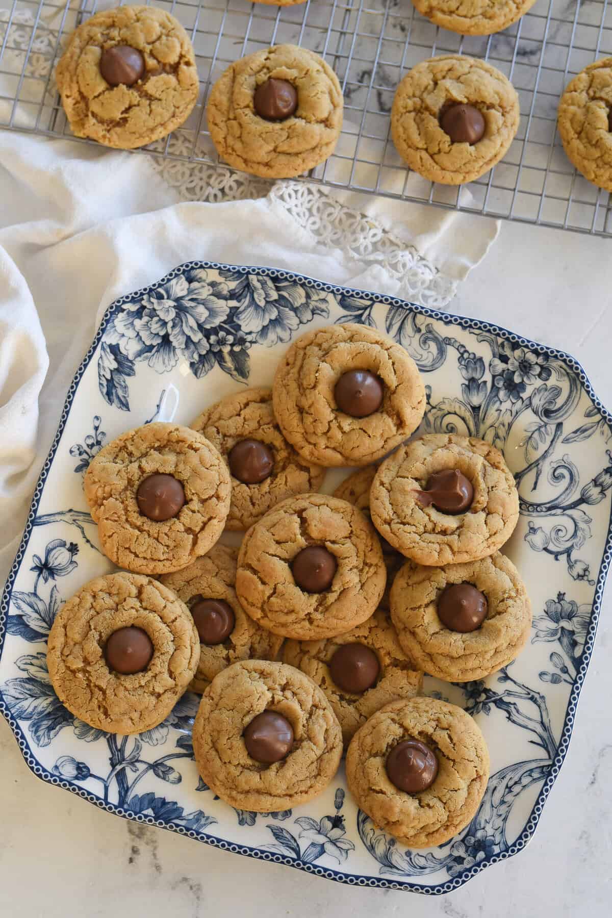 overhead shot of peanut butter blossom cookies on a plate