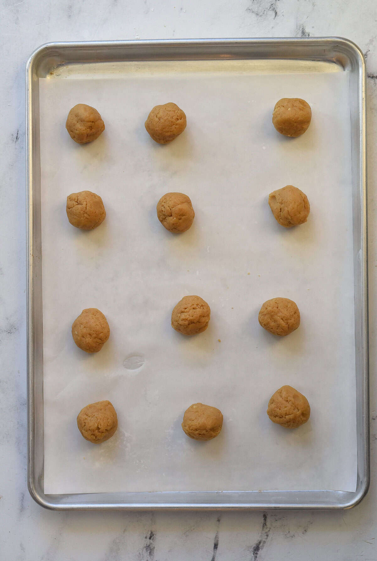 peanut butter cookei dough on baking sheet
