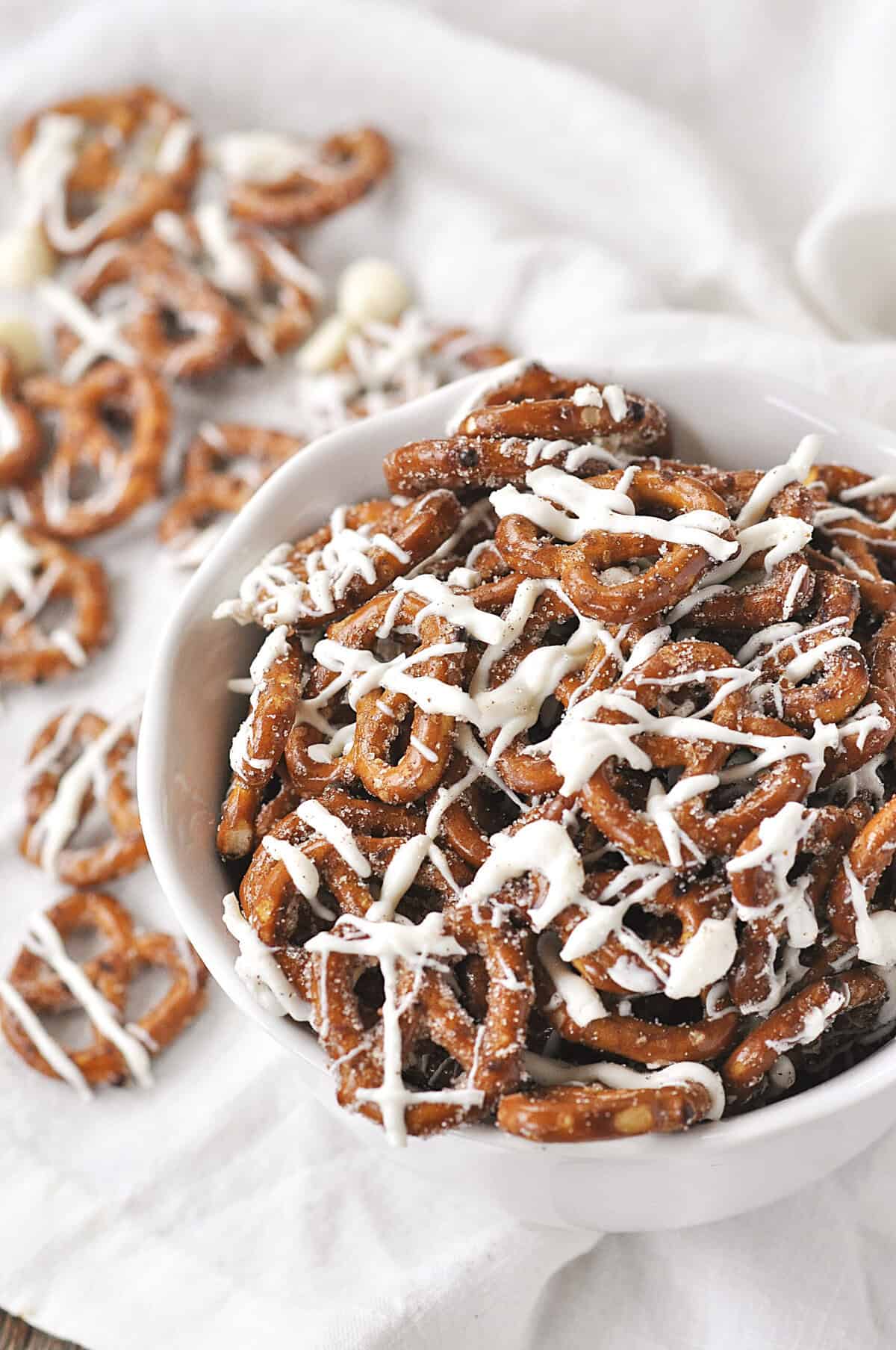 overhead shot of white bowl full of cinnamon sugar pretzels