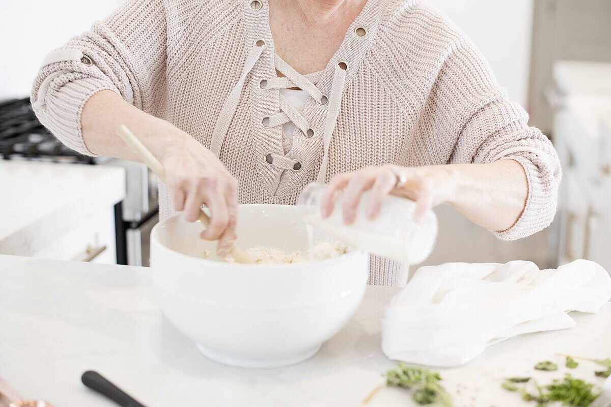pouring milk into bowl for biscuits