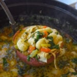 ladel full of chicken gnocchi soup