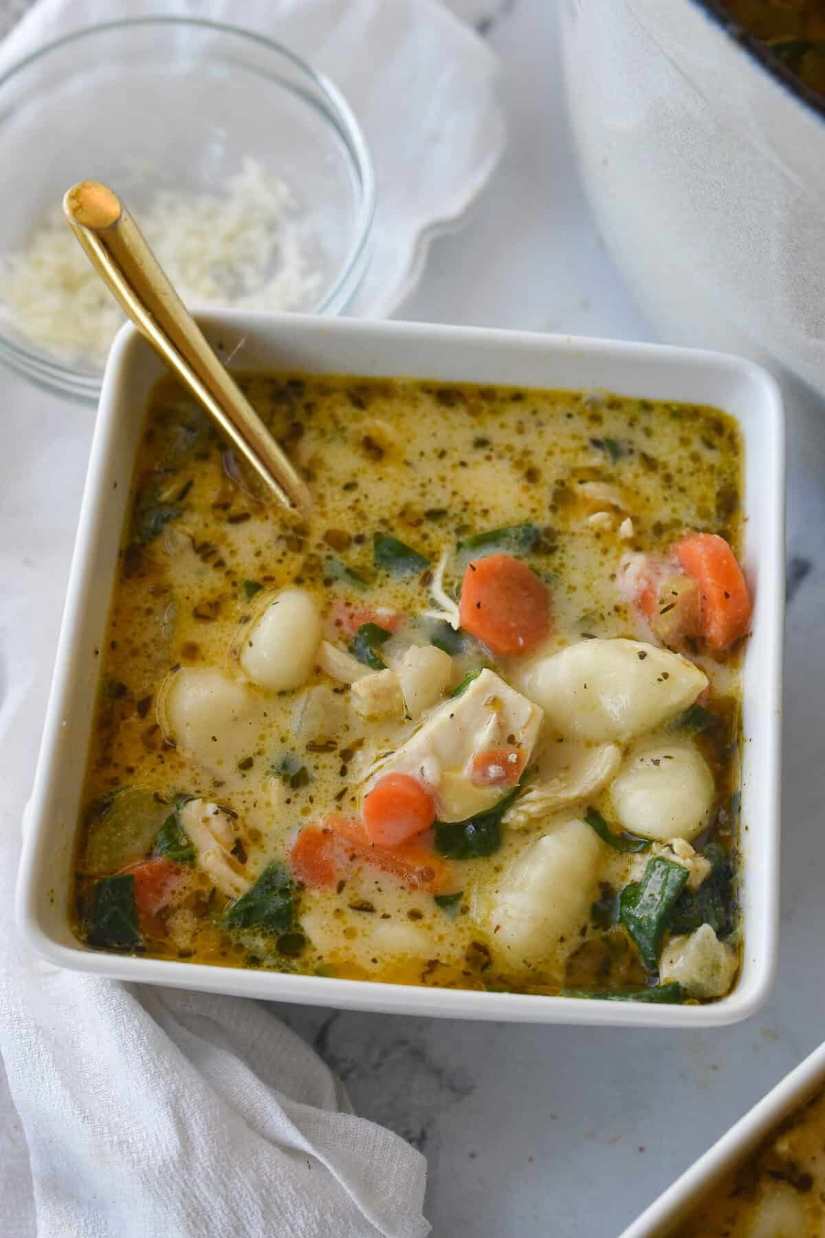 close up of bowl of chicken gnocchi soup
