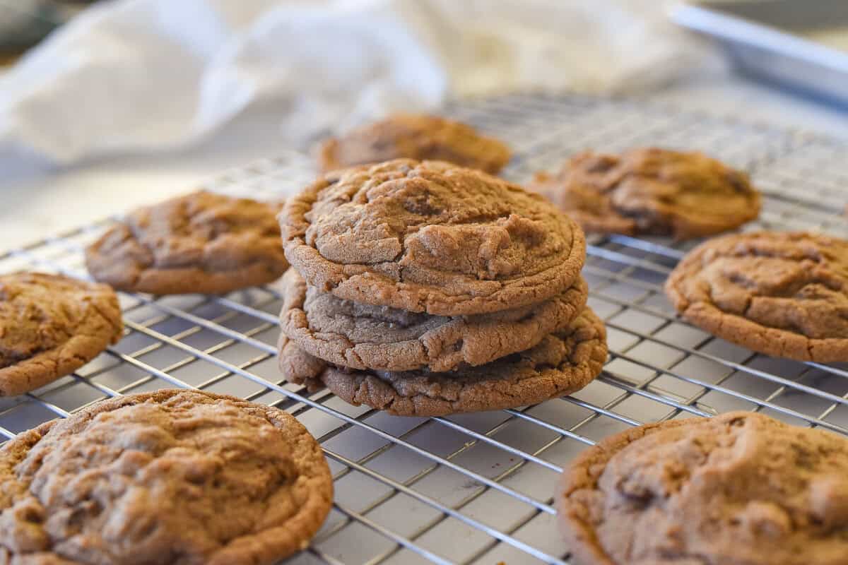 stack of 3 nutella chocolate chip cookies on a cooling rack