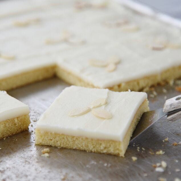 piece of white texas sheet cake on the pan