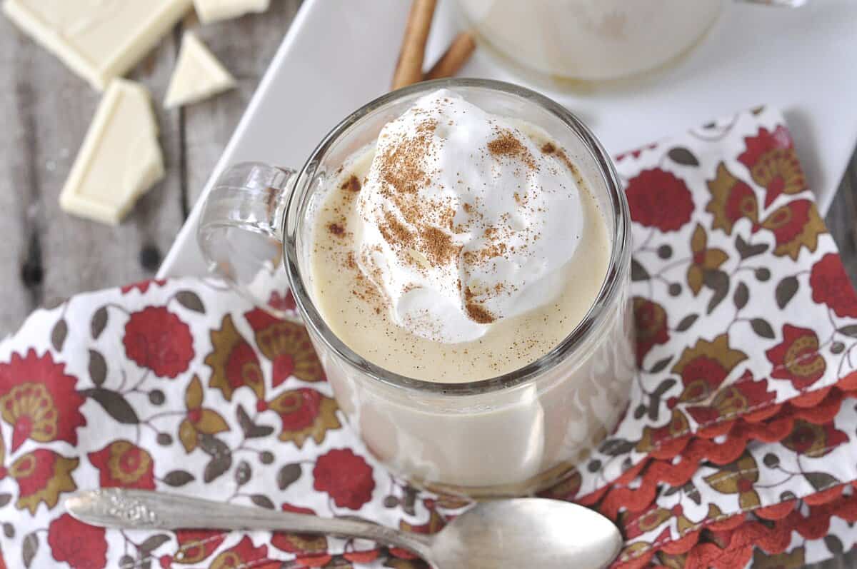 one mug of apple cider hot chocolate with whippede cream