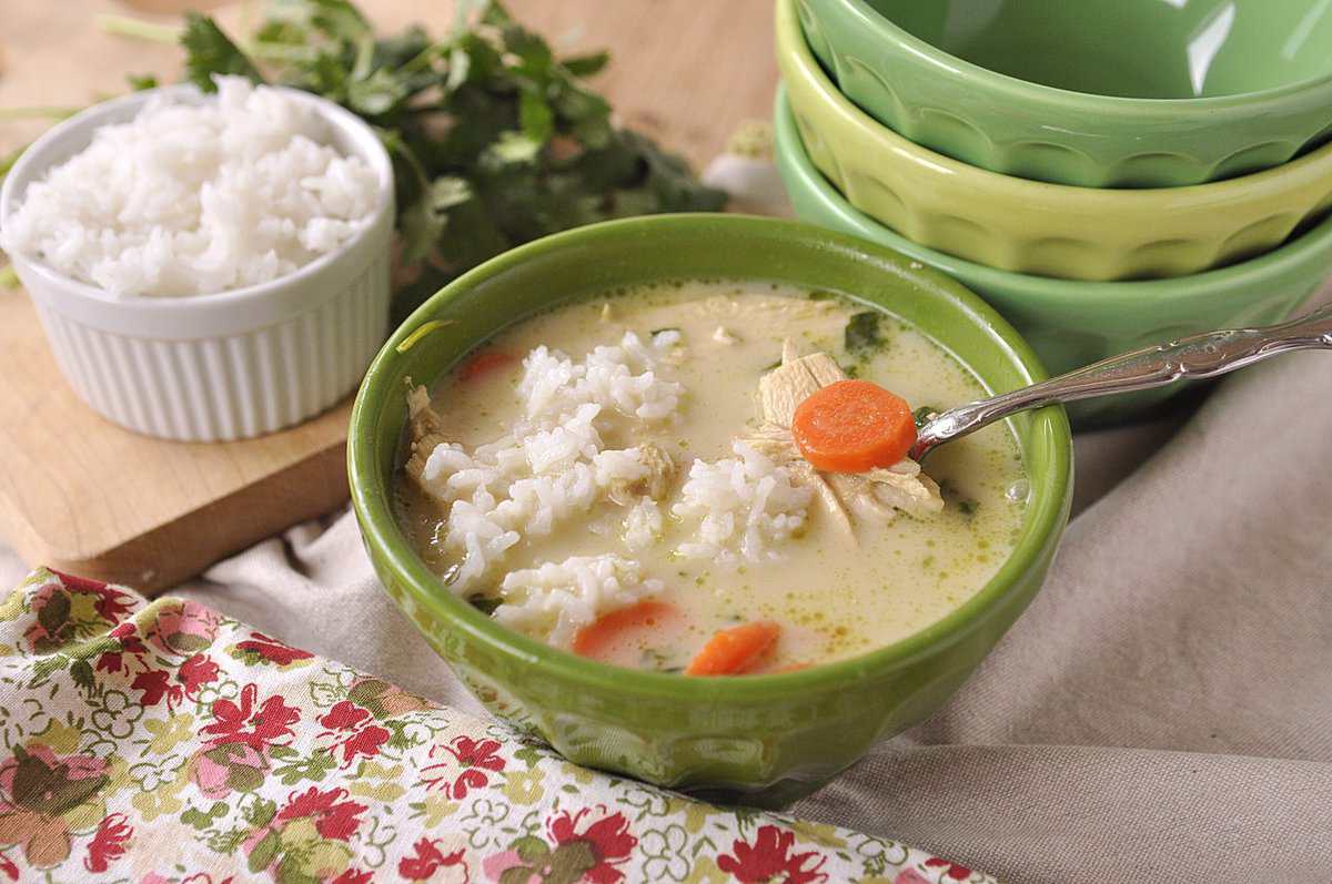 green bowl full of thai chicken coconut soup