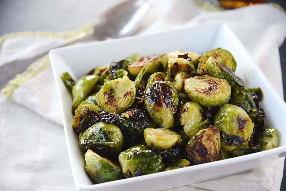 maple roasted brussels sprouts in a white bowl