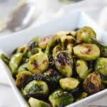 roasted maple brussels sprouts in a white bowl