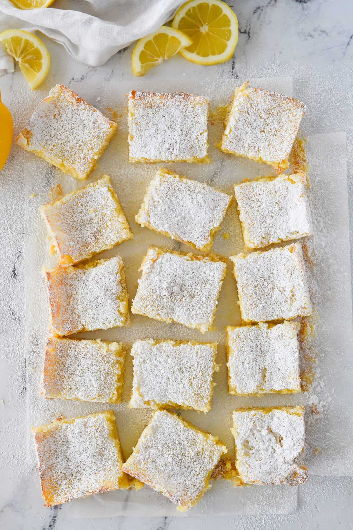 overhead shot of squares of lemon ooey gooey cake