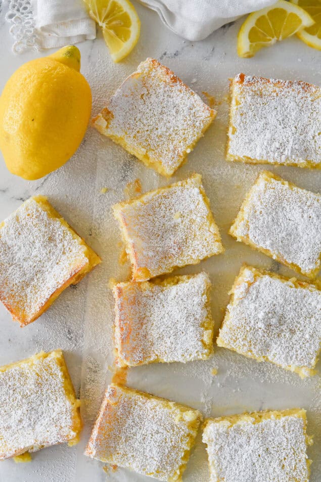overhead shot of lemon ooey gooey cake cut into squares