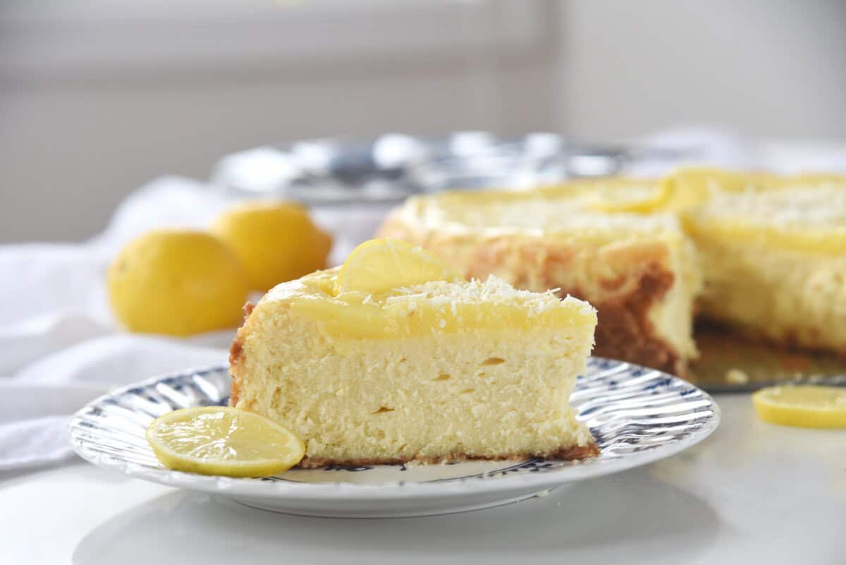sllice of lemon white chocolate cheesecake on a plate