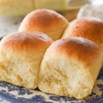 four potatoes rolls on a plate