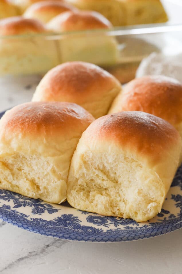 four potatoes rolls on a plate