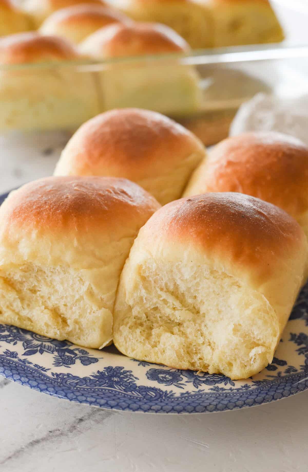 four potatoes rolls on a plate