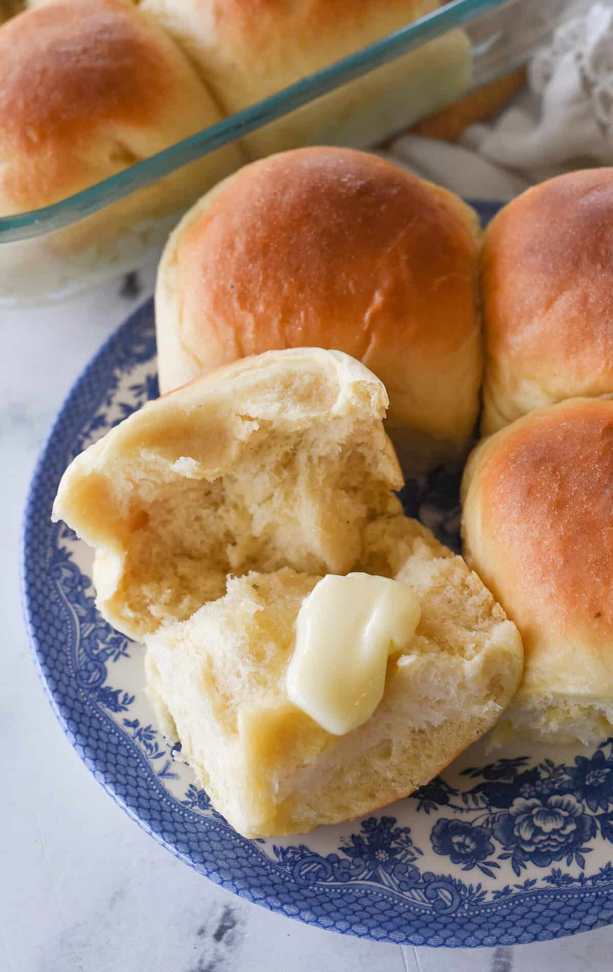 melting butter on a potato roll