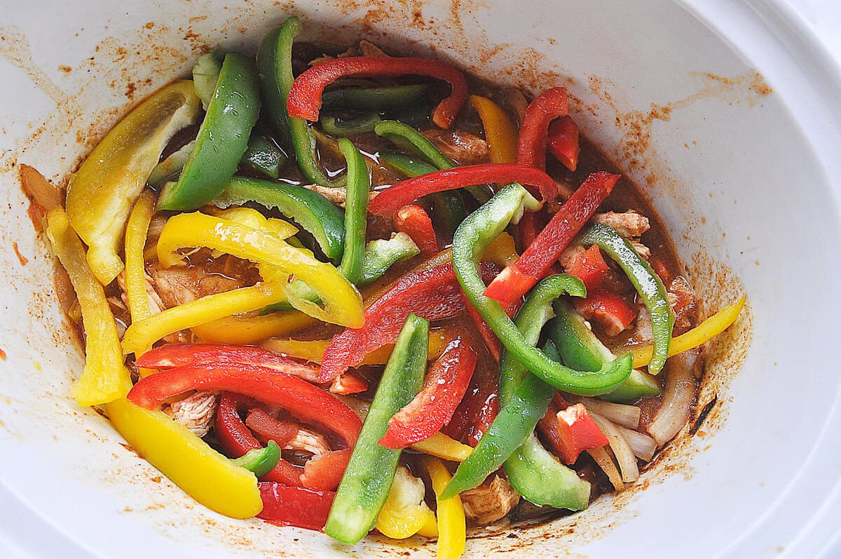 mixture of colored peppers in a slow cooker