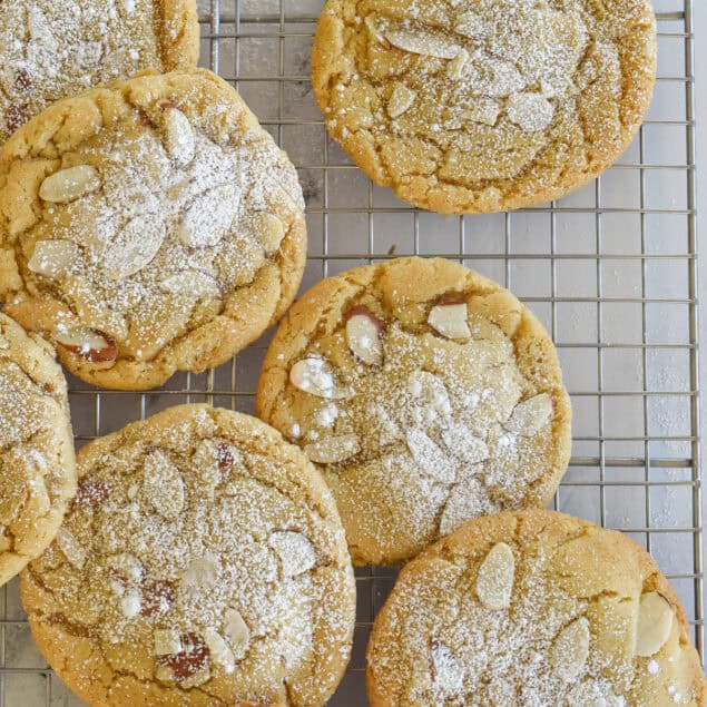 overhead shot of almond croissant cookies on cooling rack