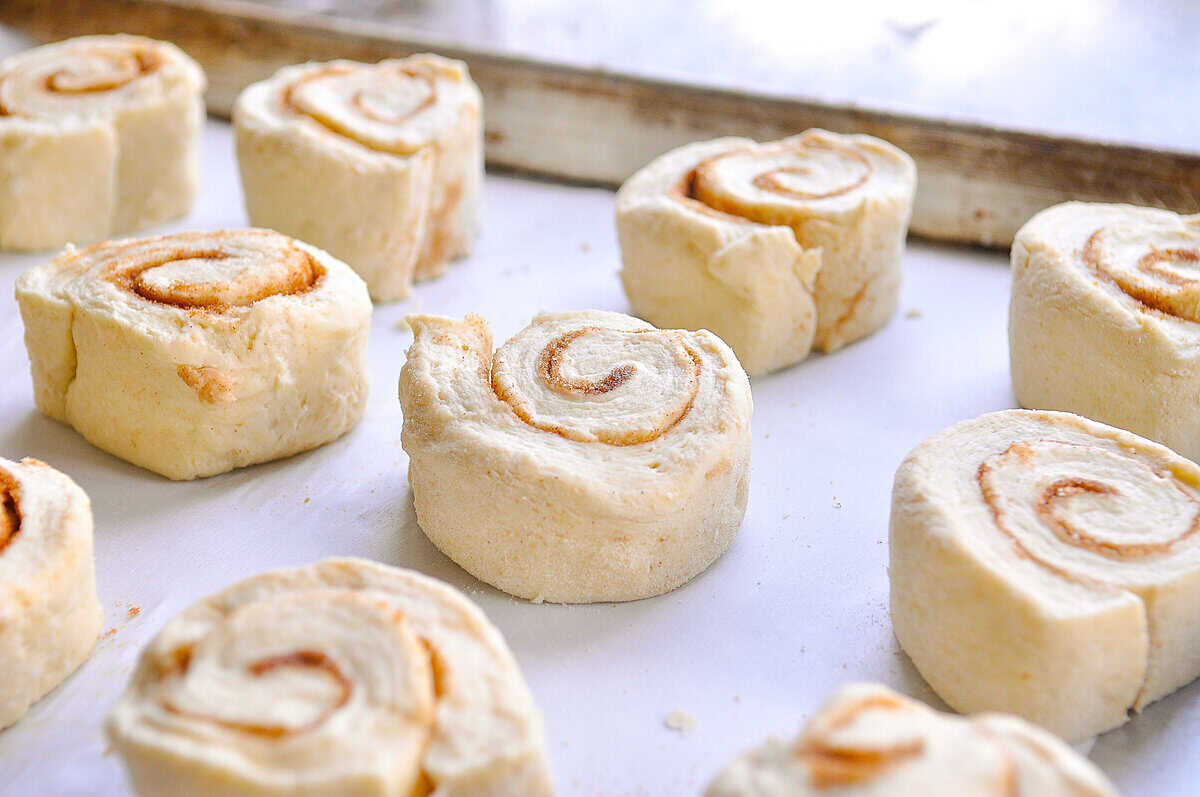 cinnamon rolls on a pan ready for the oven