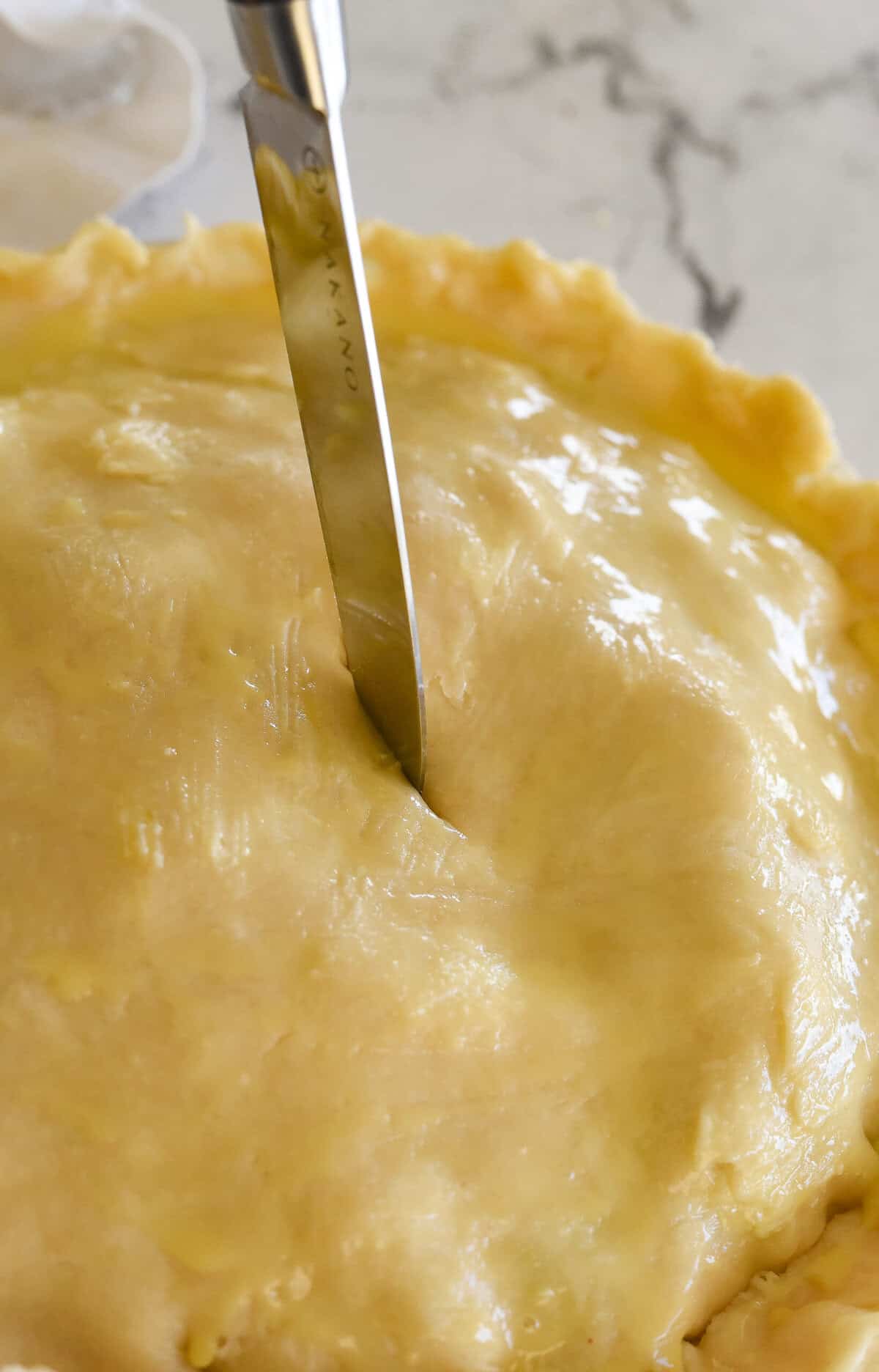 cutting as slit into pie crust
