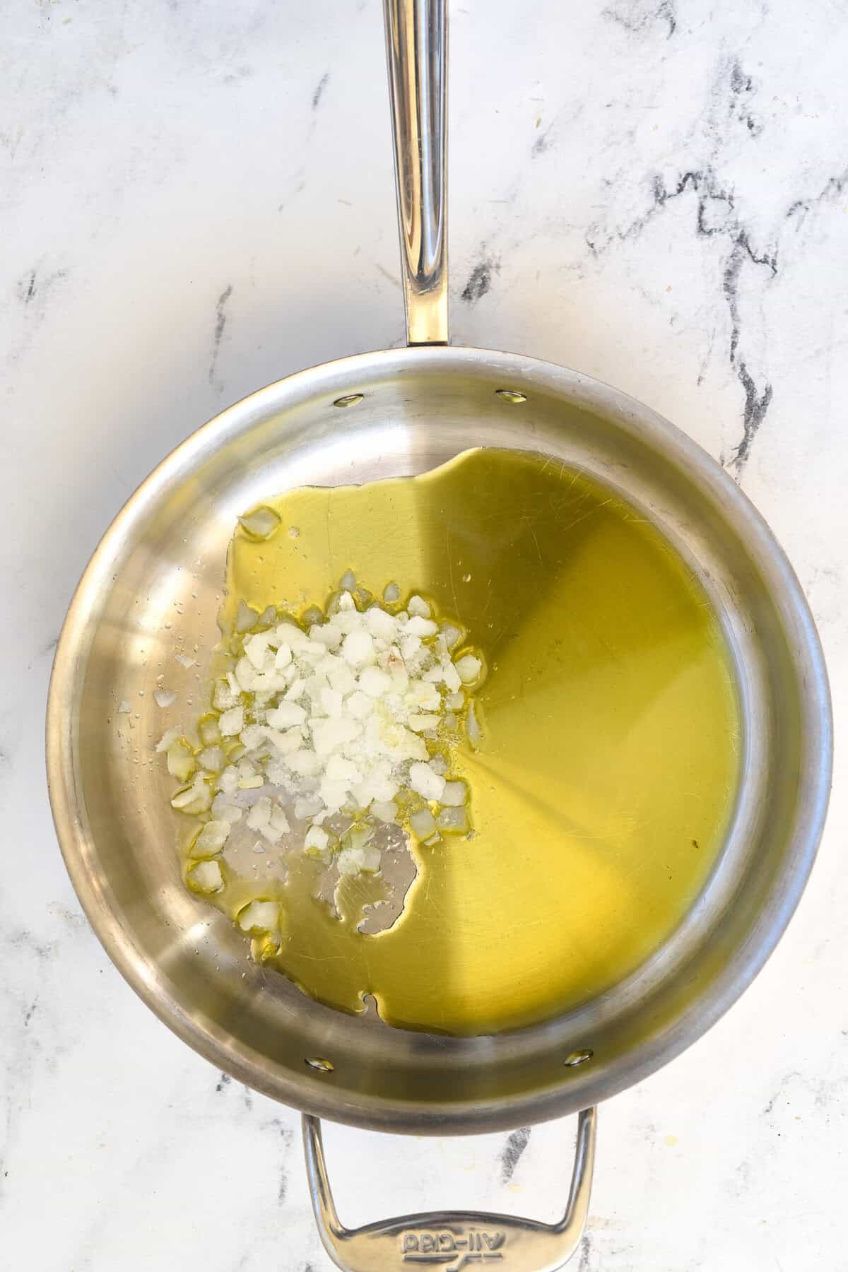 onions in olive oil in frying pan