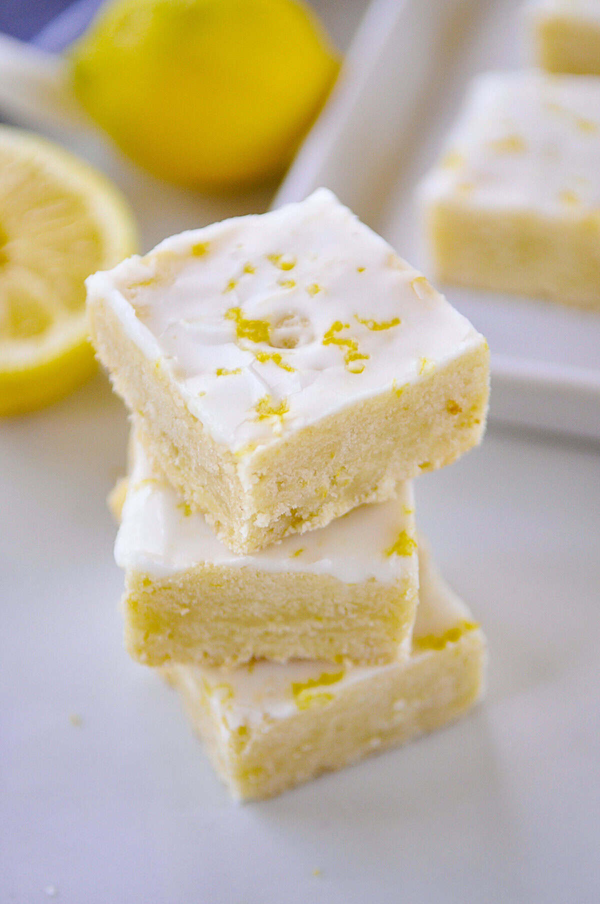 overhead shot of a stack of three pieces of lemon shortbread