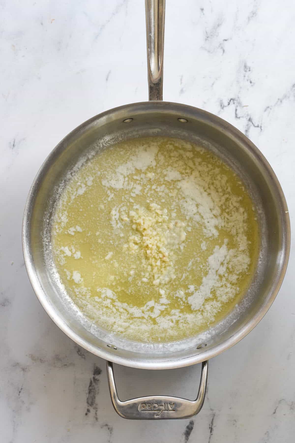 sauteeing garlic in melted butter