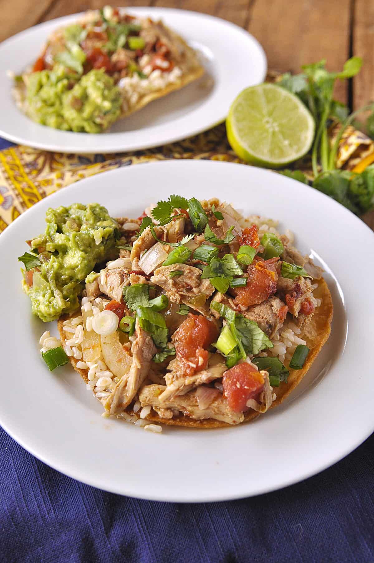 two chicken tinga tostadas