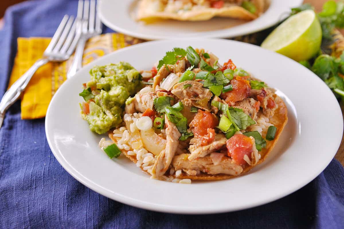 chicken tinga on a tortilla on a plate