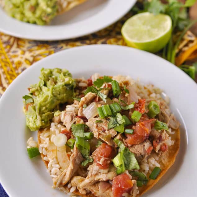 chicken tostada on a white plate